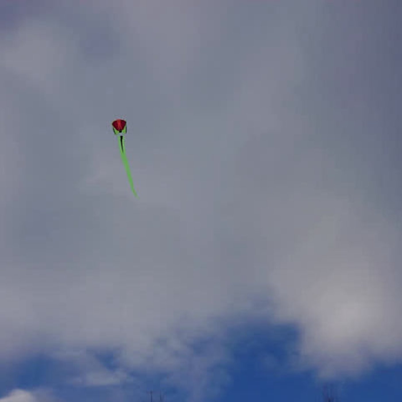 Flying a kite over a snowy mountain ridge episode artwork